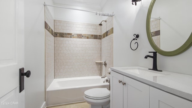 full bathroom with toilet, tiled shower / bath combo, vanity, and crown molding