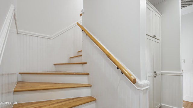 staircase featuring hardwood / wood-style floors