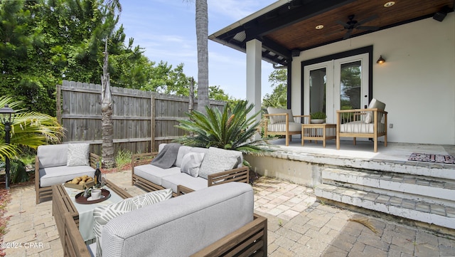 view of patio with ceiling fan and an outdoor living space