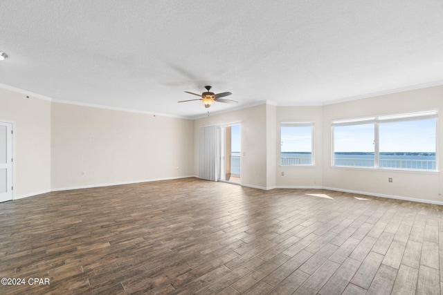 empty room featuring baseboards, a textured ceiling, a ceiling fan, and wood finished floors