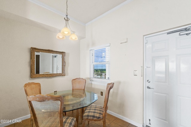 tiled dining space with baseboards and ornamental molding