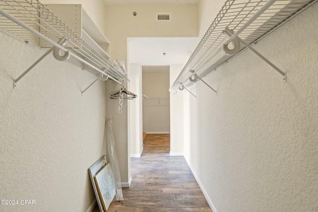 walk in closet featuring hardwood / wood-style flooring