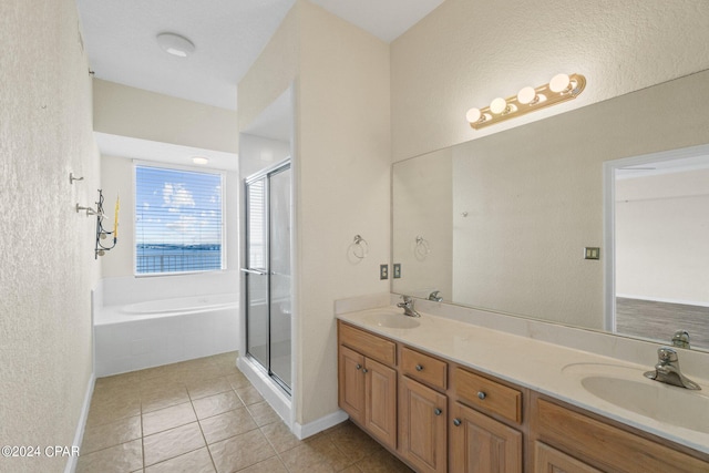 bathroom featuring tile patterned flooring, vanity, and independent shower and bath