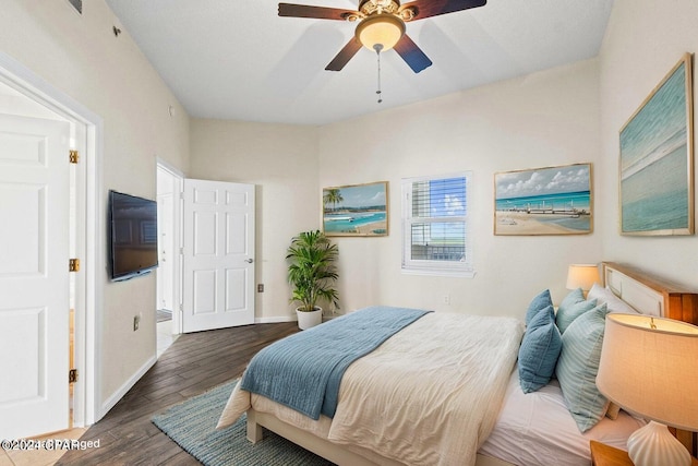 bedroom with ceiling fan, baseboards, and wood finished floors