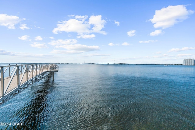 dock area featuring a pier and a water view