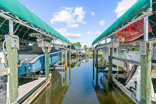 dock area with a water view