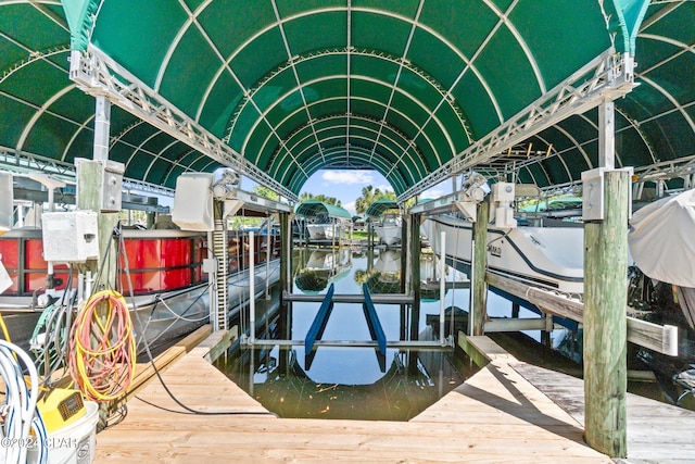 dock area featuring a water view and boat lift