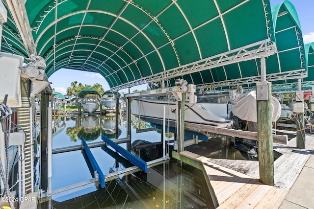 view of dock featuring a water view and boat lift