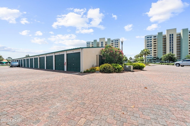 view of property featuring community garages