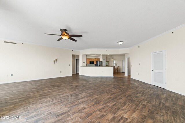 unfurnished living room with ceiling fan, dark hardwood / wood-style flooring, and ornamental molding