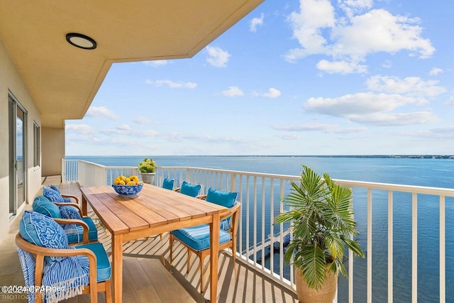 balcony featuring a water view