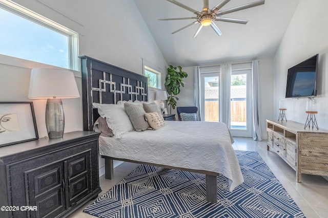 bedroom with vaulted ceiling, access to outside, and light tile patterned floors