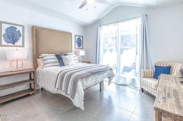 bedroom featuring lofted ceiling, tile patterned floors, and ceiling fan