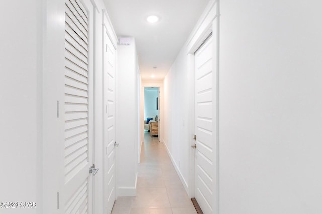 corridor featuring light tile patterned flooring