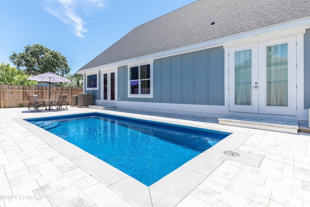 view of pool with a patio area and french doors