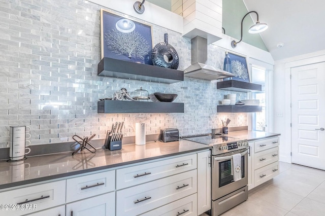 kitchen featuring white cabinetry, electric range, and wall chimney exhaust hood