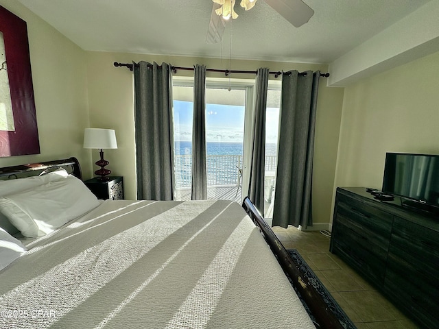 bedroom featuring light tile patterned floors, a textured ceiling, access to outside, and ceiling fan