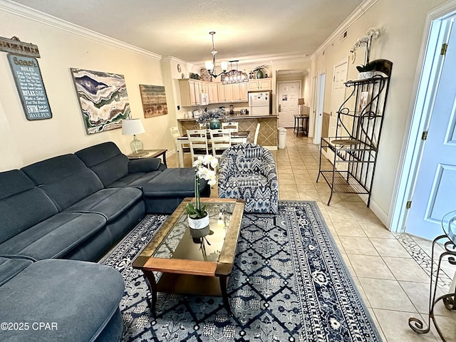 tiled living room with ornamental molding, a textured ceiling, and an inviting chandelier