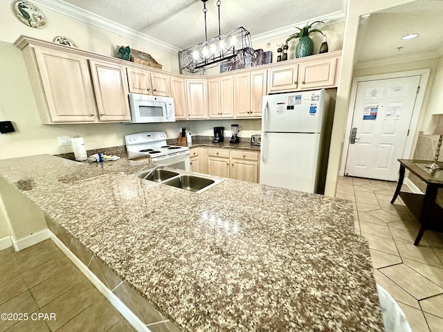 kitchen featuring a notable chandelier, kitchen peninsula, a textured ceiling, white appliances, and light tile patterned floors