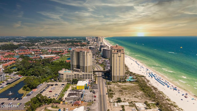 aerial view with a water view, a beach view, and a city view