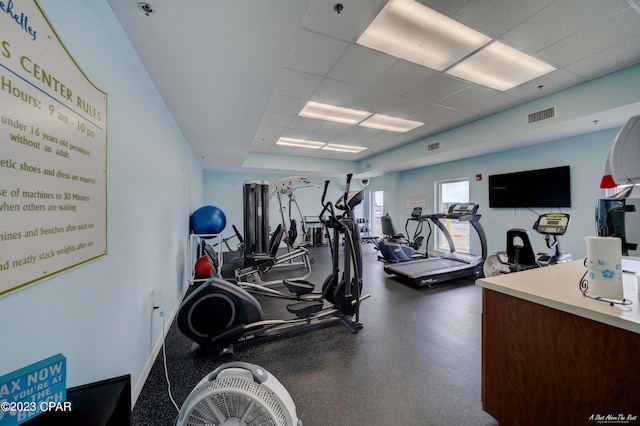 workout area featuring a drop ceiling