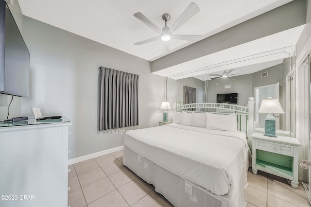 bedroom with light tile patterned floors