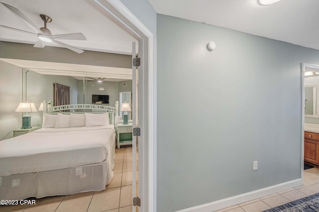 tiled bedroom with connected bathroom