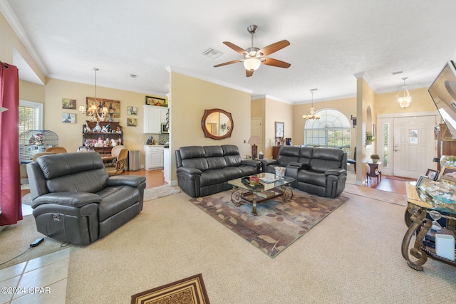 carpeted living room featuring crown molding and ceiling fan with notable chandelier