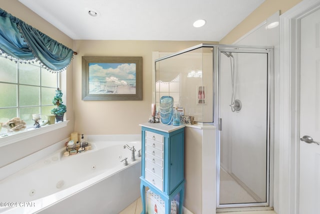 bathroom featuring a whirlpool tub, recessed lighting, and a shower stall