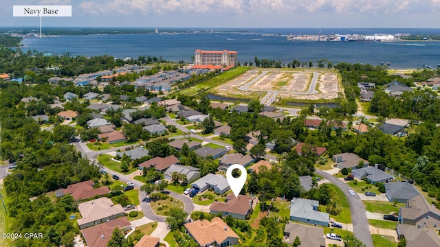 bird's eye view featuring a water view and a residential view