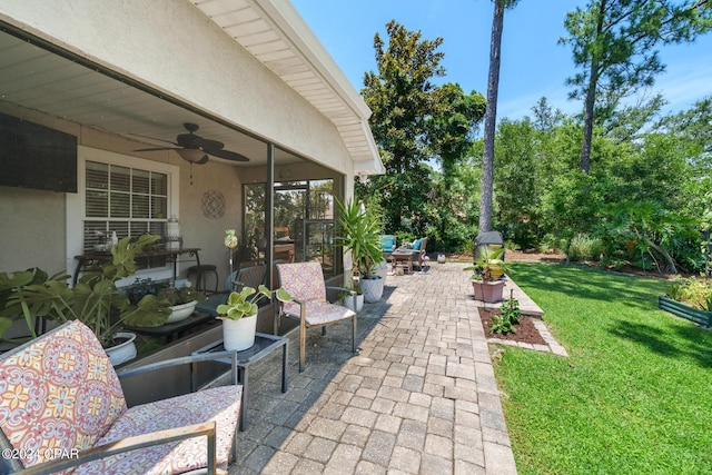 view of patio / terrace featuring ceiling fan