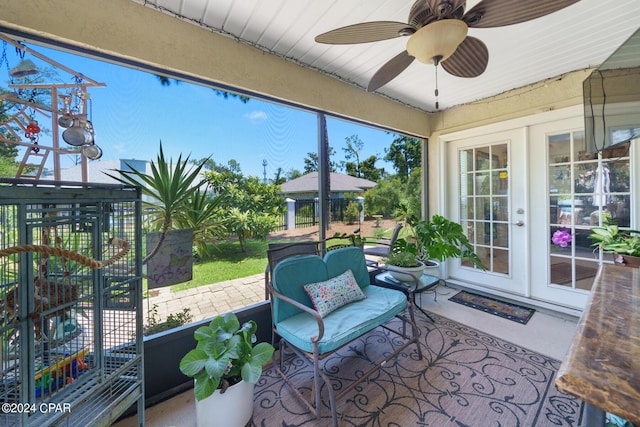 sunroom with ceiling fan and french doors