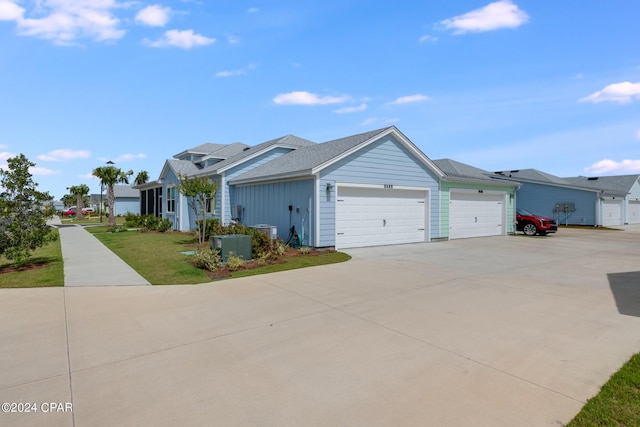 single story home with a garage and a front yard