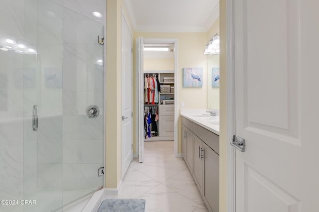 bathroom featuring an enclosed shower, vanity, and crown molding