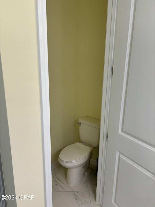 bathroom featuring toilet