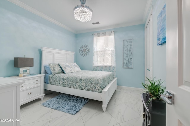 bedroom with crown molding and an inviting chandelier