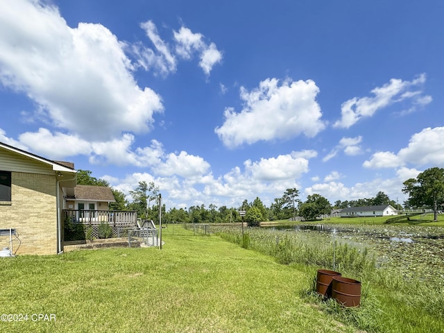 view of yard featuring a wooden deck