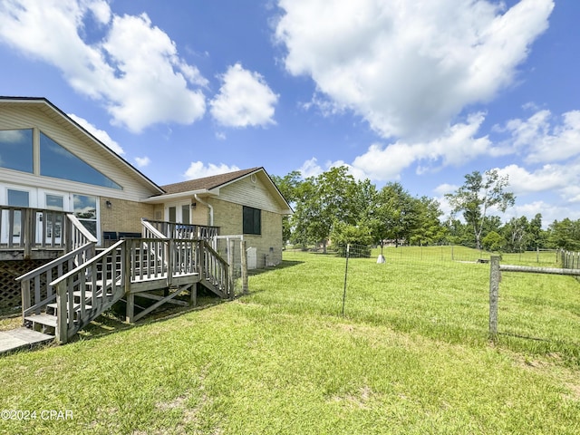 view of yard featuring a wooden deck