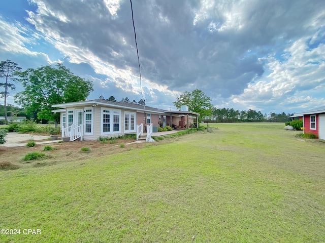 exterior space featuring a front lawn