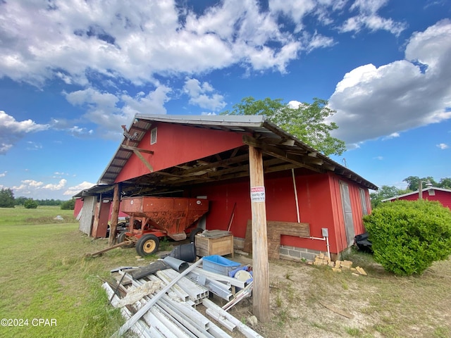 view of home's exterior featuring an outdoor structure