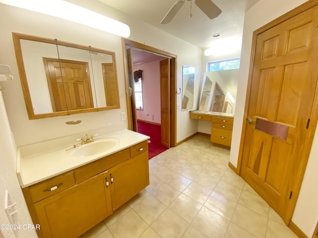 bathroom with ceiling fan and vanity