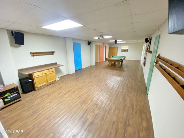 game room with a paneled ceiling, light hardwood / wood-style floors, and pool table