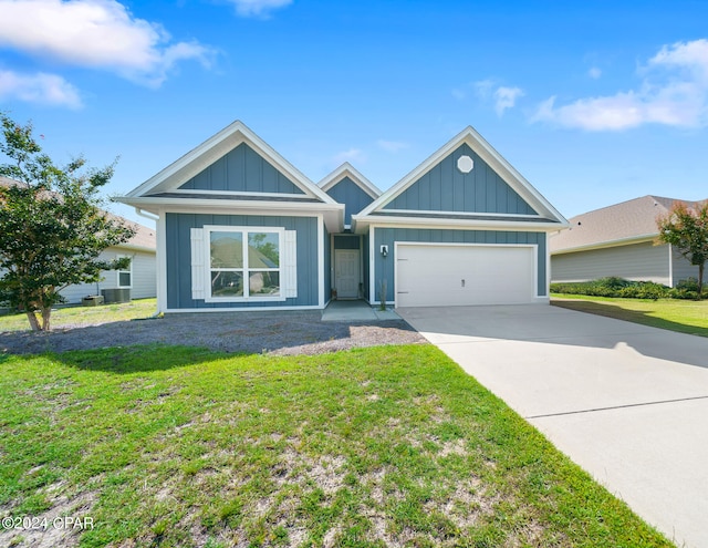 view of front of home featuring a garage and a front yard