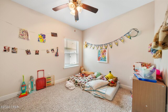 playroom featuring ceiling fan and carpet flooring