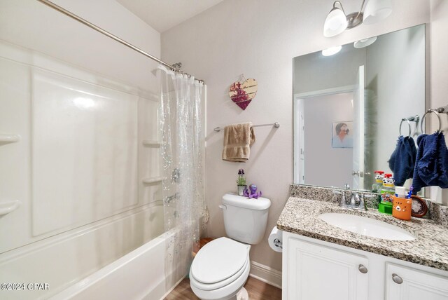 full bathroom with vanity, shower / bath combo with shower curtain, wood-type flooring, and toilet