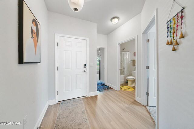 foyer entrance with light hardwood / wood-style flooring