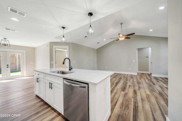 kitchen with sink, white cabinetry, a center island with sink, stainless steel dishwasher, and pendant lighting