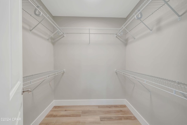 interior details featuring tiled shower