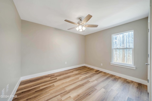 unfurnished room with ceiling fan and light hardwood / wood-style flooring