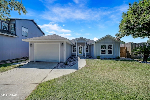 view of front of home featuring a garage and a front yard